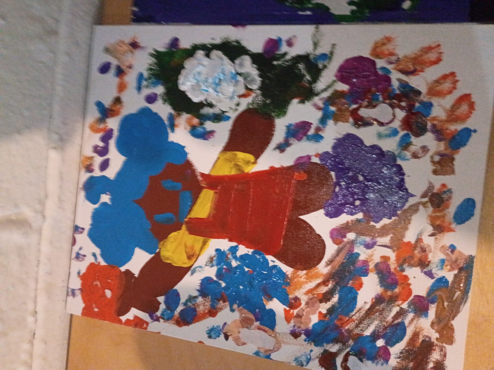 A colorful abstract painting with layered marks and shapes
