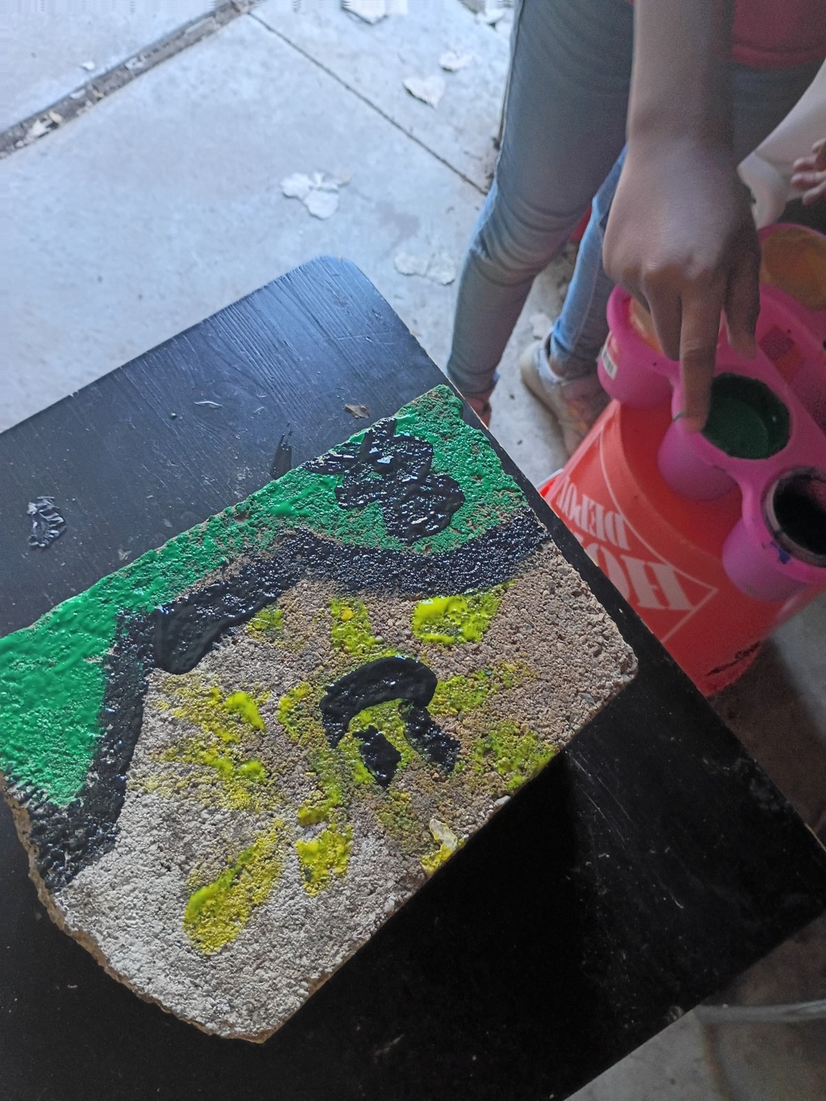 A colorful painting in progress at the art table